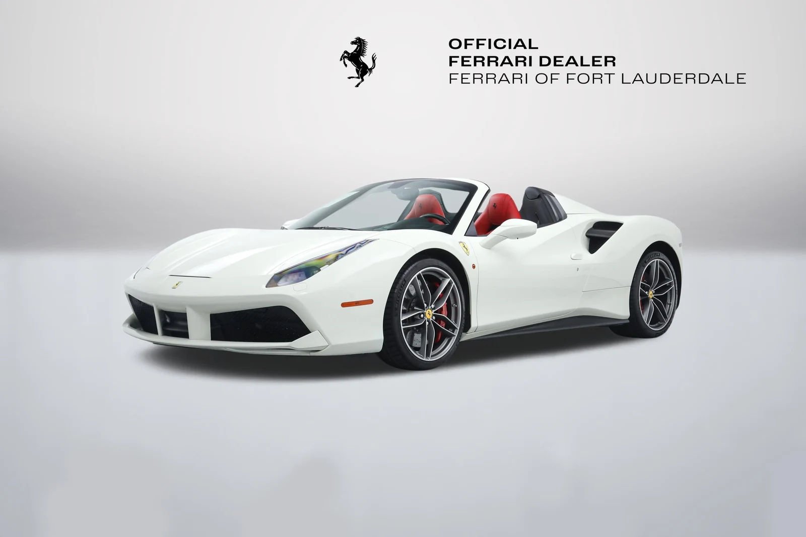 Bianco Avus Ferrari 488 Spider in a front three-quarter view