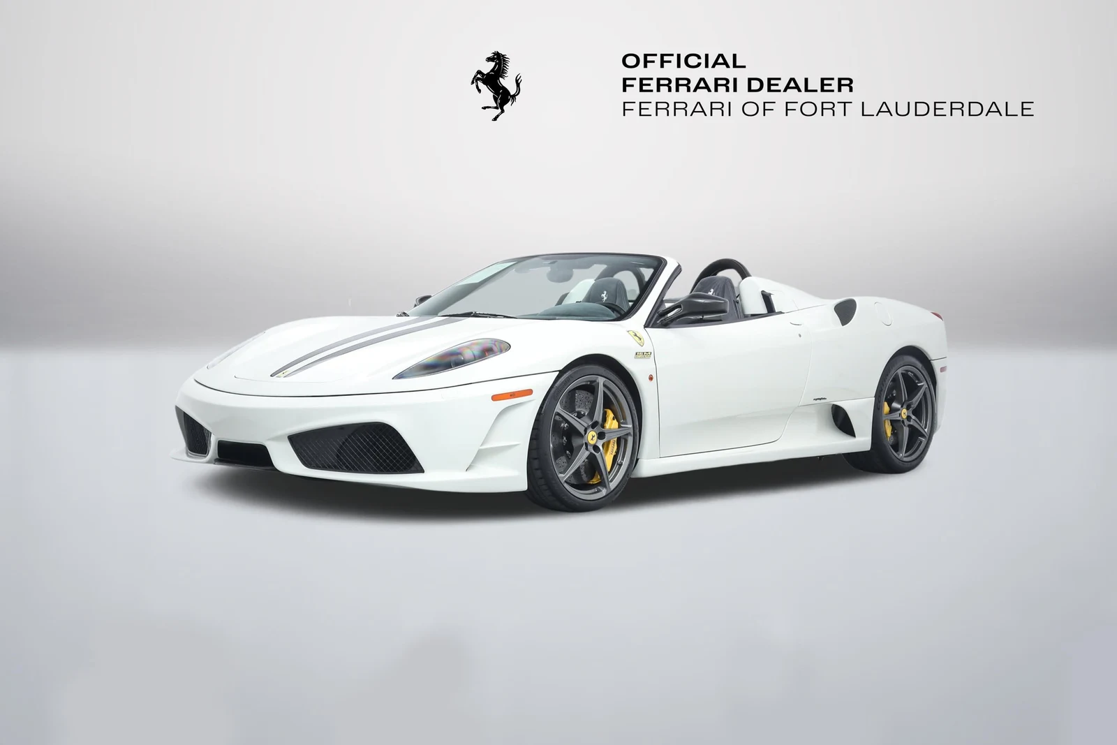 Bianco Avus Ferrari Scuderia Spider 16M in a front three-quarter view