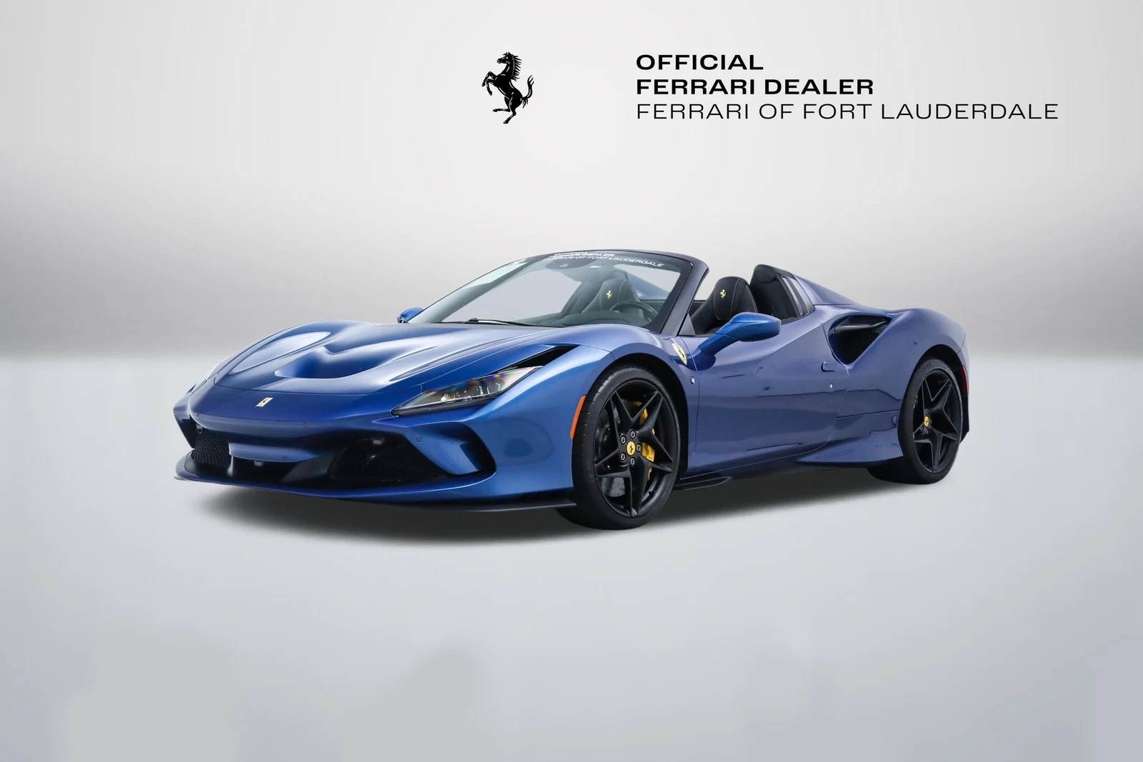 Blu Mirabeau Ferrari F8 Spider in a front three-quarter view