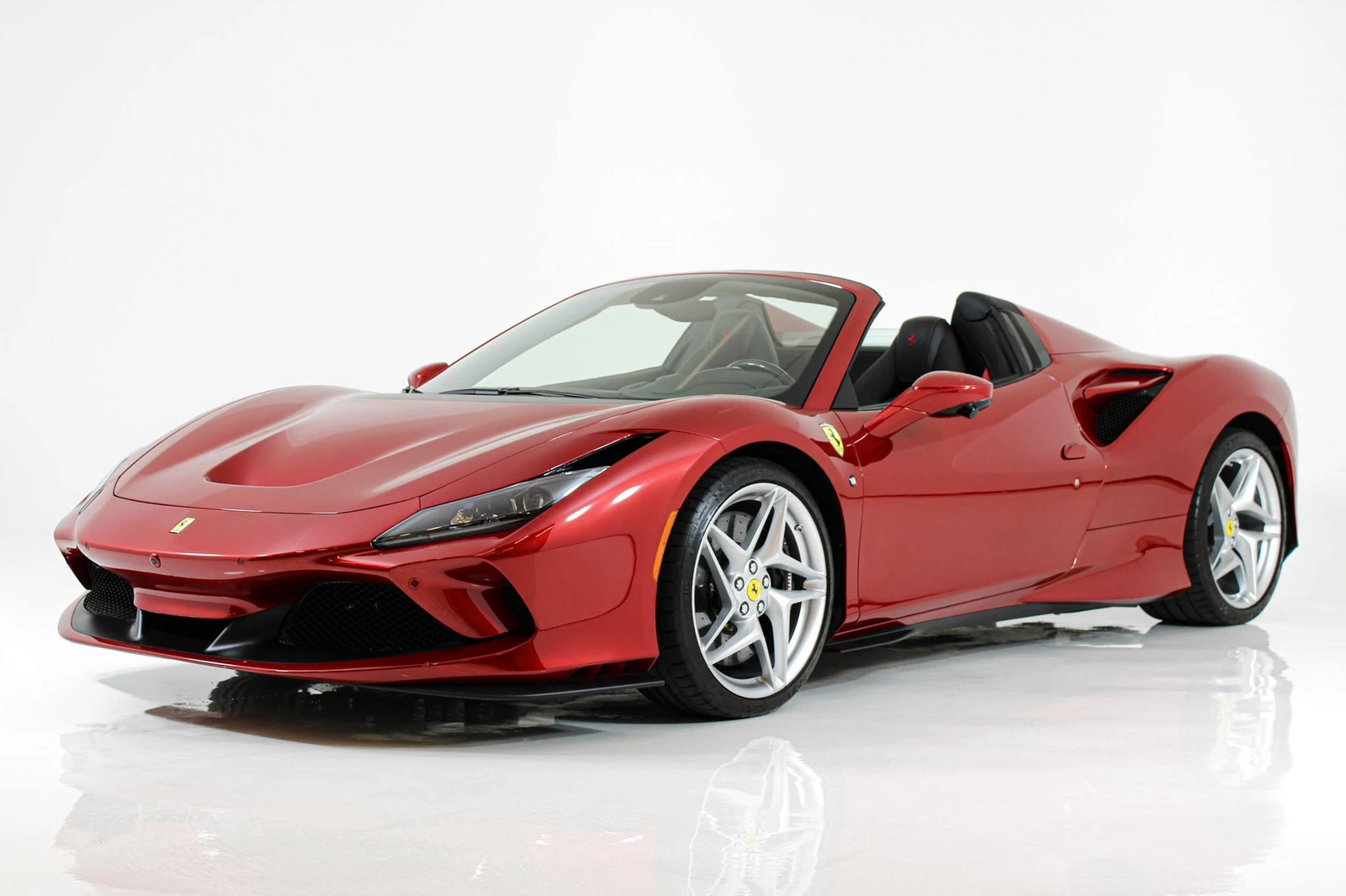 Rosso Portofino Ferrari F8 Spider in a front three-quarter view