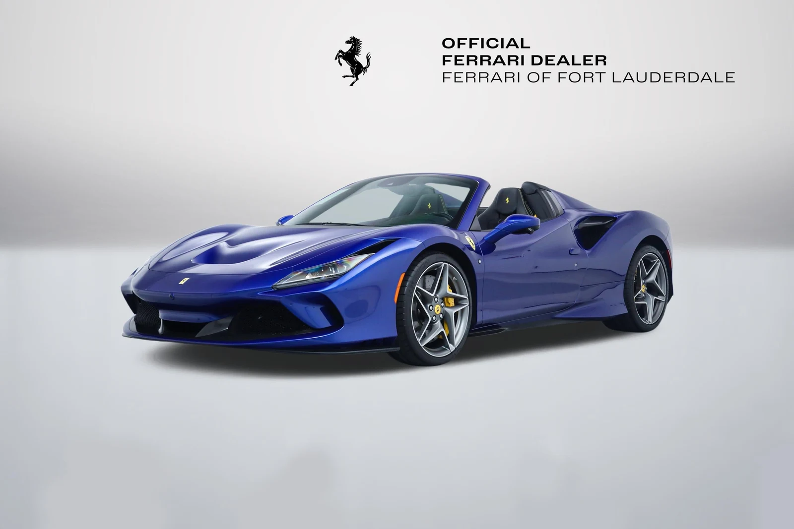 Blu Elettrico Ferrari F8 Spider in a front three-quarter view