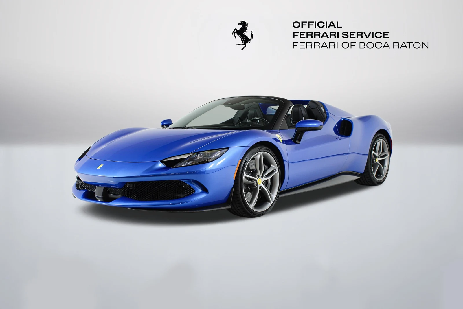 Blu Corsa Ferrari 296 GTS in a front three-quarter view