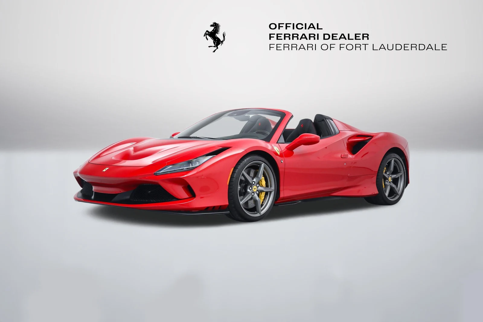 Rosso Corsa Ferrari F8 Spider in a front three-quarter view