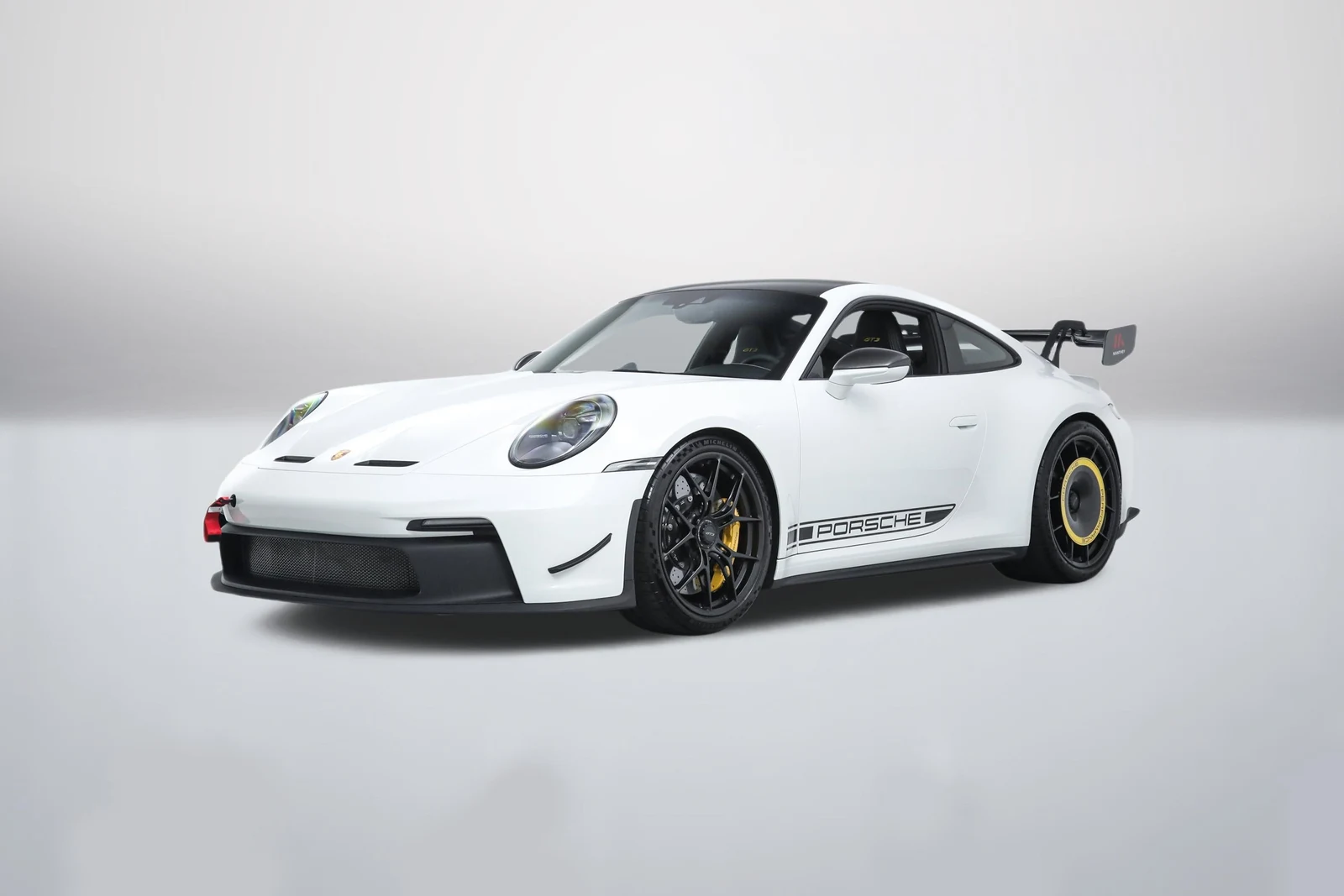 White Porsche 911 (992.1) GT3 in a front three-quarter view
