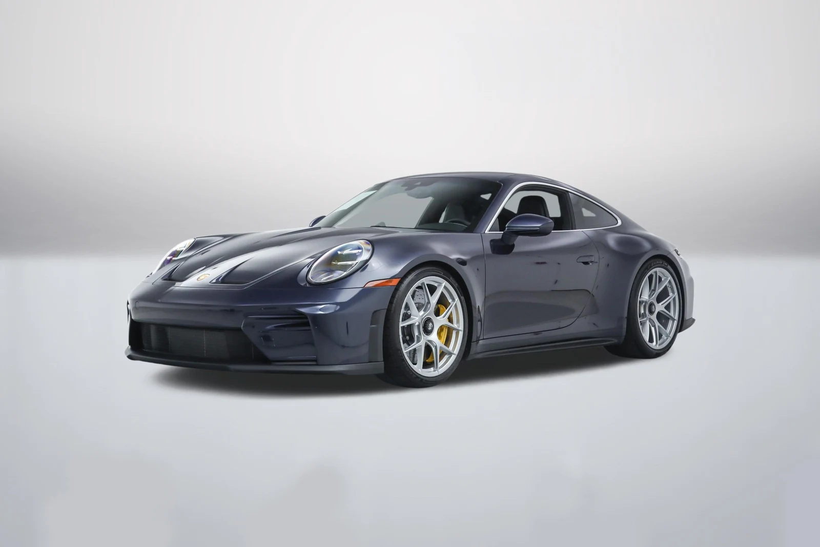 Paint to Sample Dark Sapphire Metallic Porsche 911 (992.2) GT3 Touring in a front three-quarter view