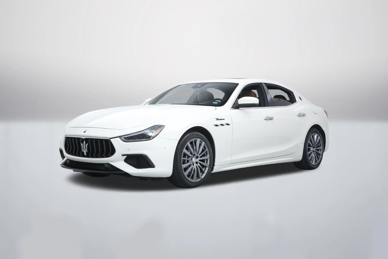 Bianco Maserati Ghibli Modena in a front three-quarter view