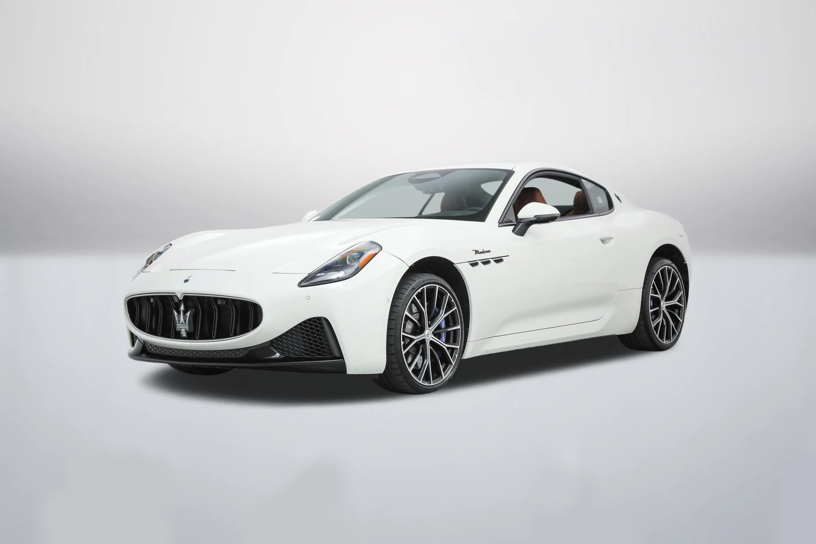 Bianco Maserati GranTurismo Modena in a front three-quarter view