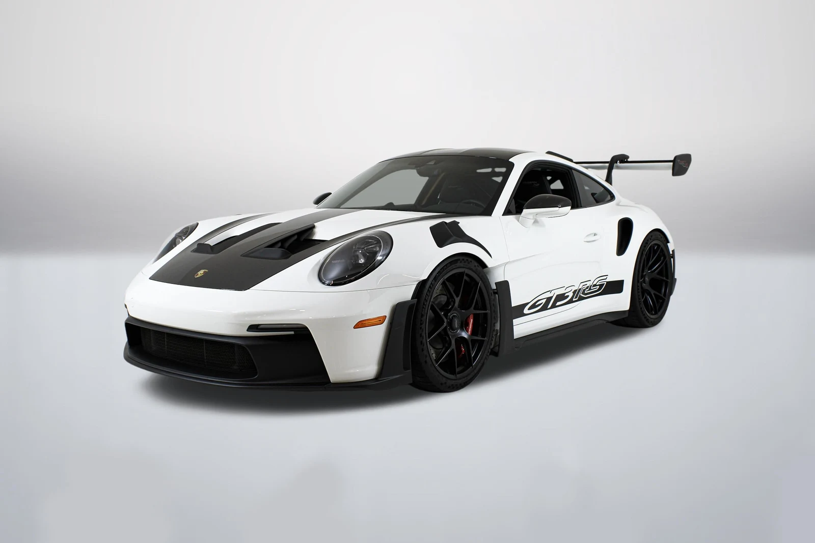 White Porsche 911 (992.1) GT3 RS in a front three-quarter view