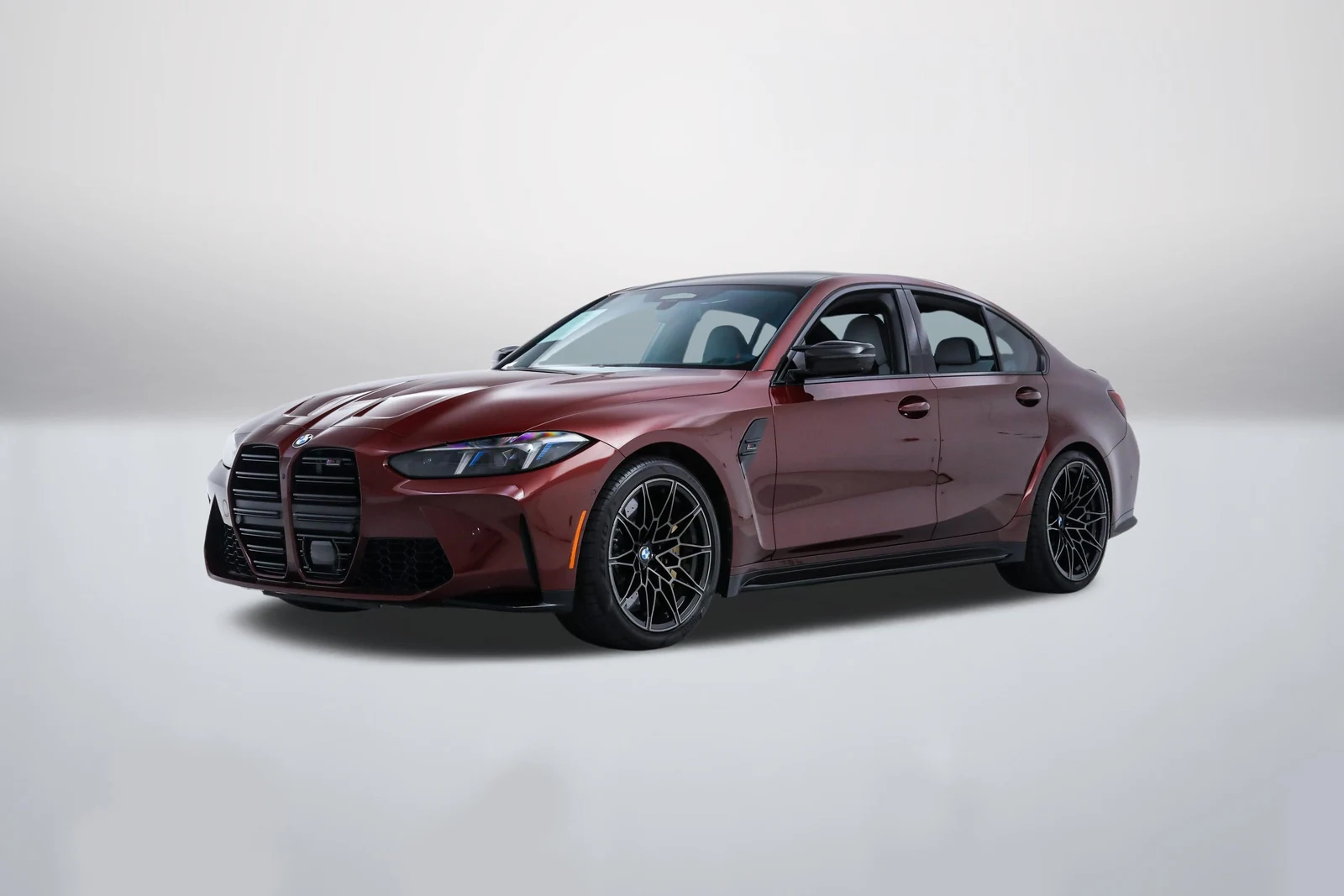 Aventurin Red Metallic BMW M3 Competition xDrive (G80) in a front three-quarter view