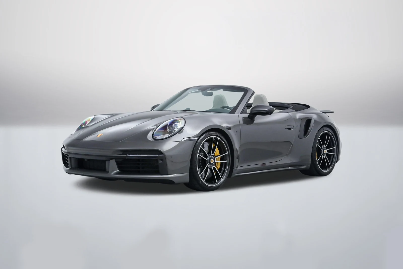 Agate Grey Metallic Porsche 911 (992.1) Turbo S Cabriolet in a front three-quarter view