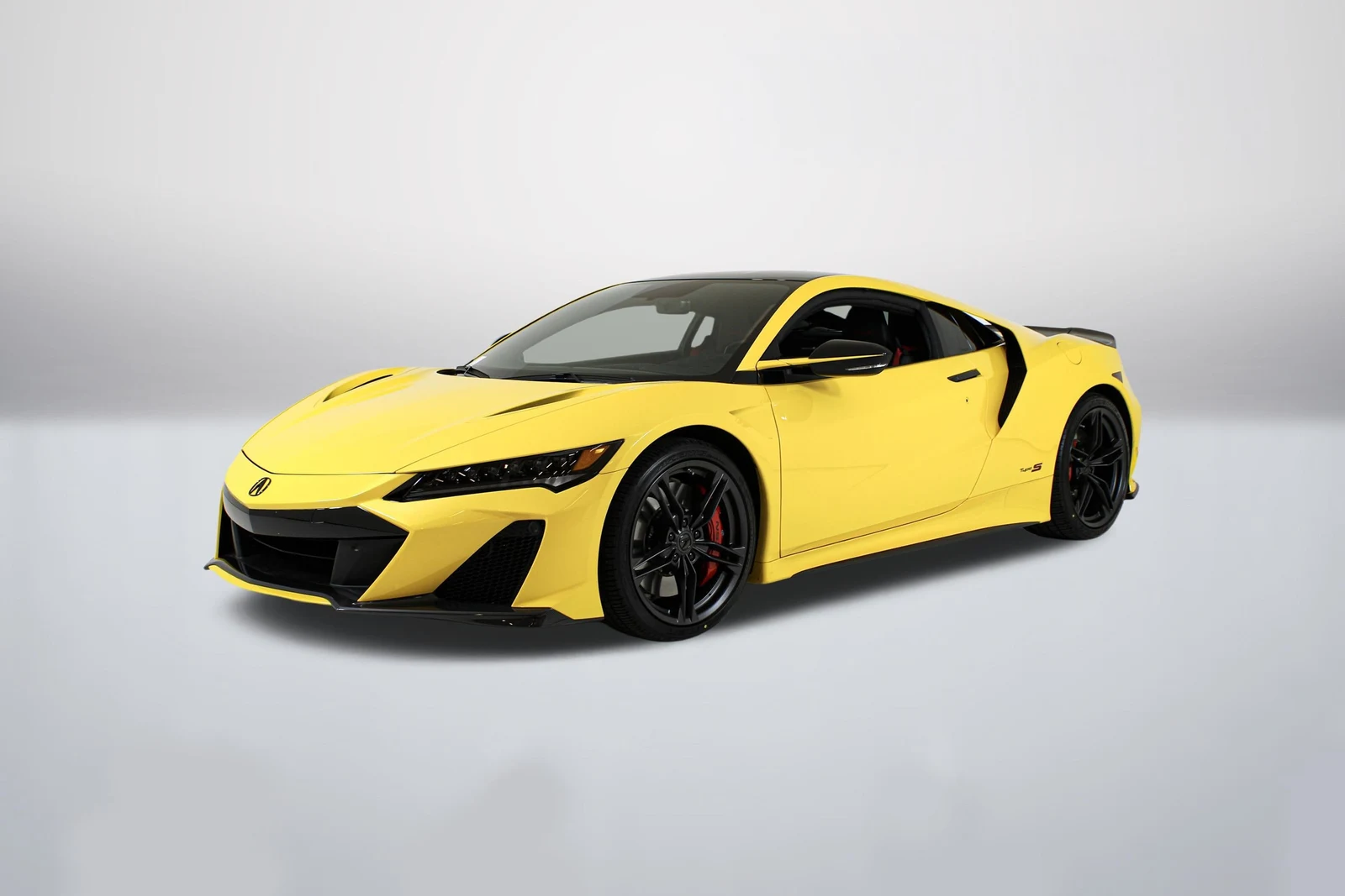 Indy Yellow Pearl Acura NSX Type S (2nd Generation) in a front three-quarter view