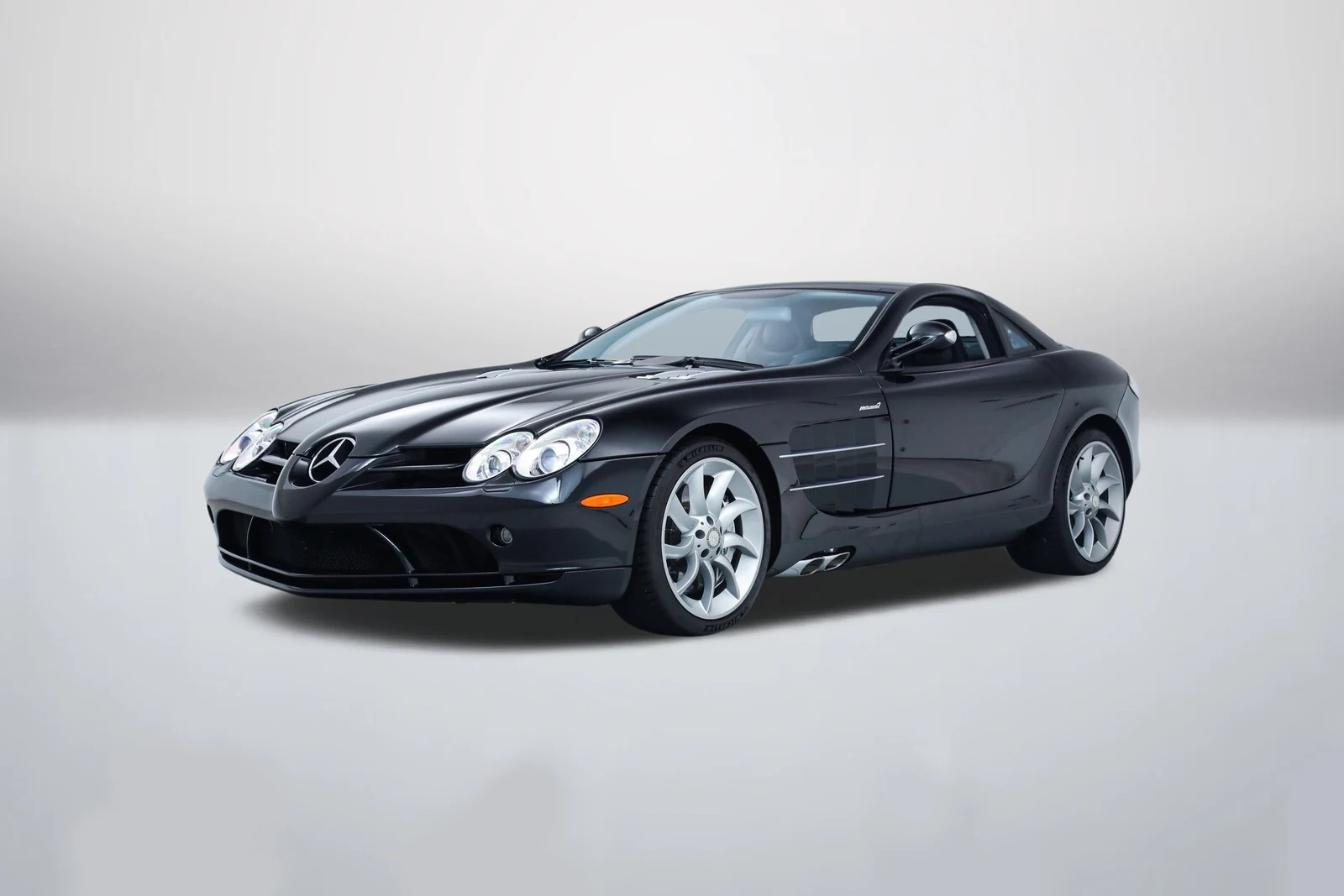 Black Mercedes-Benz SLR McLaren in a front three-quarter view