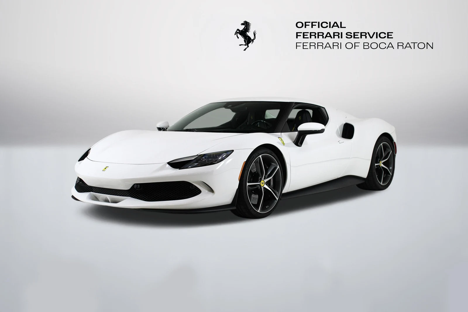 Bianco Cervino Ferrari 296 GTB in a front three-quarter view