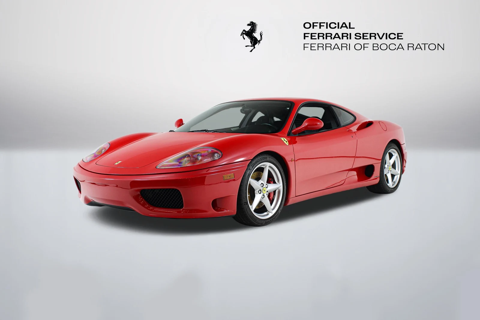 Rosso Corsa Ferrari 360 Modena in a front three-quarter view