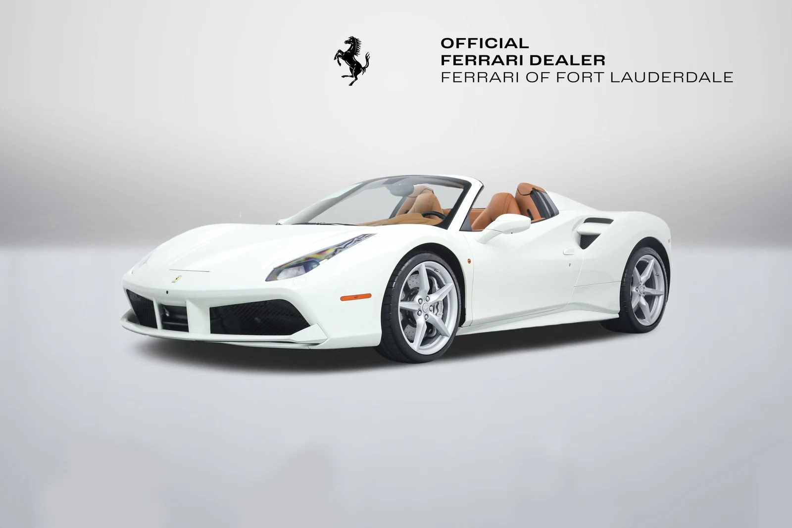 Bianco Avus Ferrari 488 Spider in a front three-quarter view