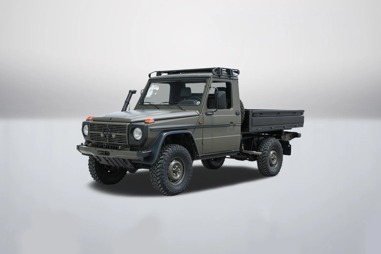 Matte dark green Mercedes-Benz 290 GD Pickup in a front three-quarter view