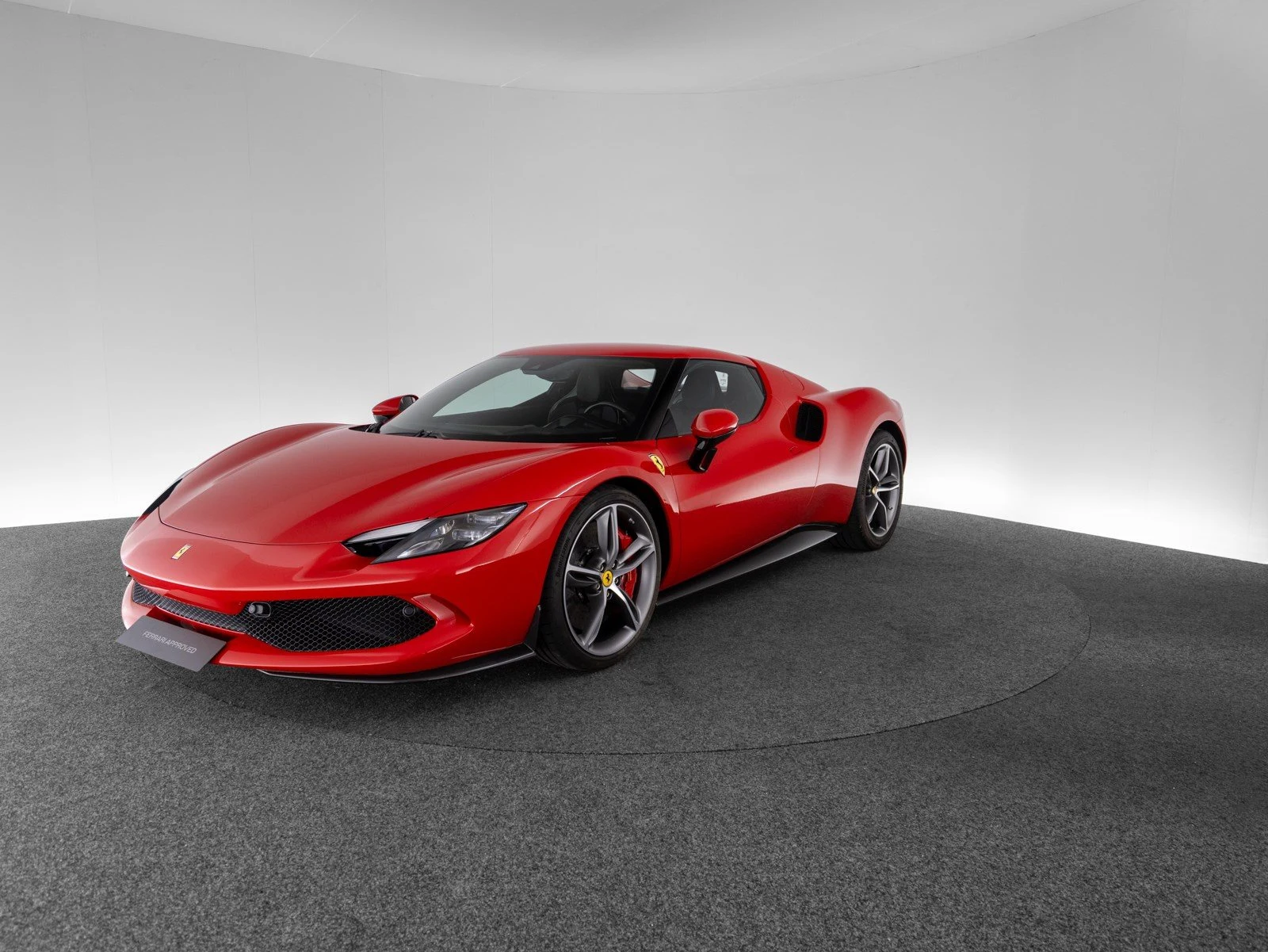 Ferrari 296 GTB, full-car front three-quarter view.