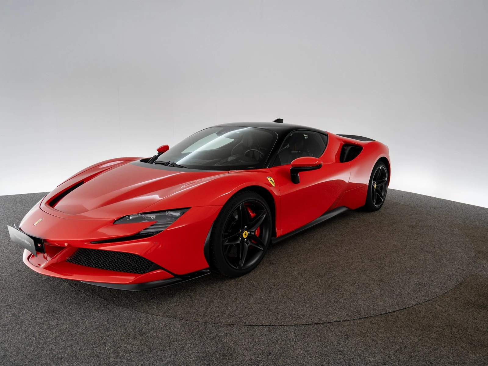 Ferrari SF90 Stradale Assetto Fiorano, full-car front three-quarter view.