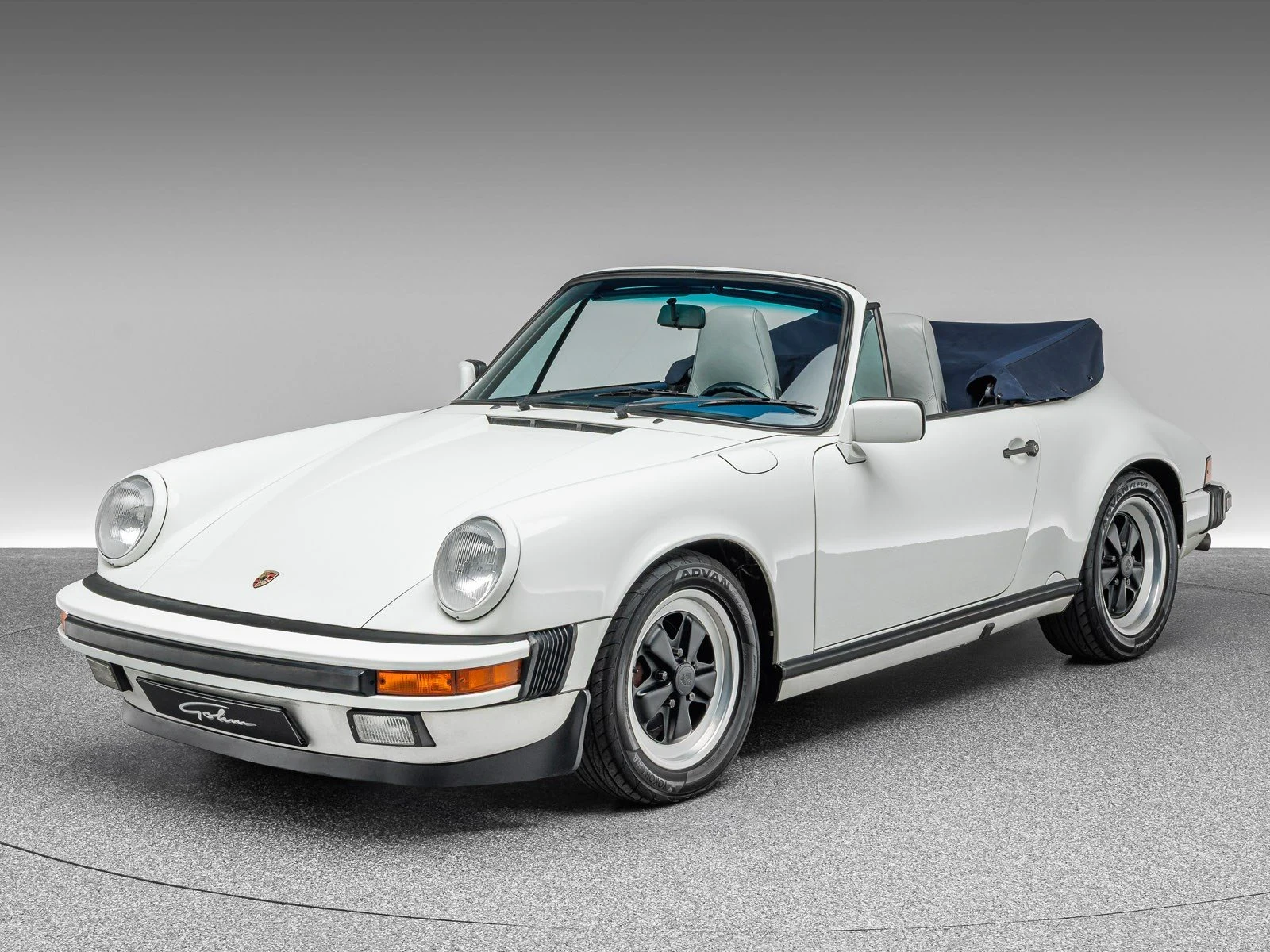 Porsche 911 Carrera Cabriolet, full-car front three-quarter view.