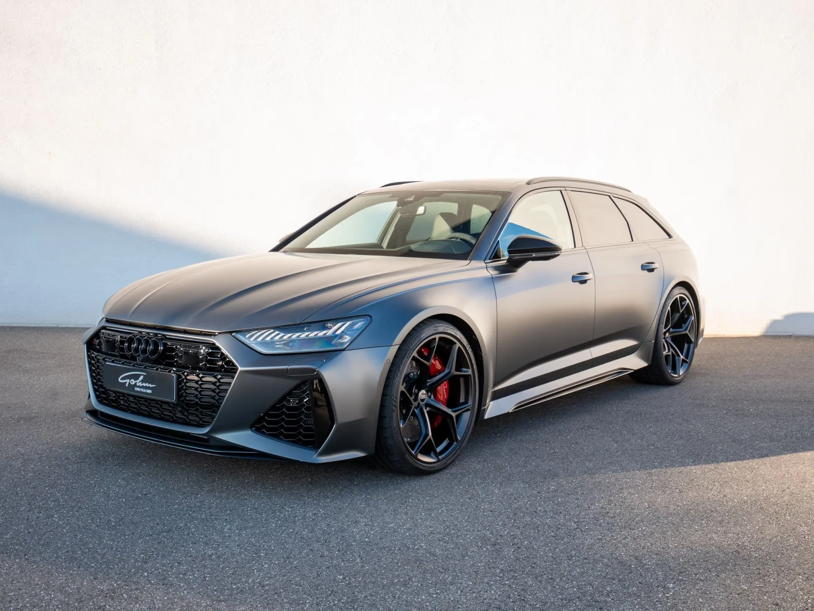 Audi RS6 Avant performance, full-car front three-quarter view.