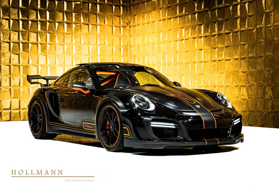 Metallic black Porsche 911 Turbo S TECHART GTstreet R, front three-quarter view.