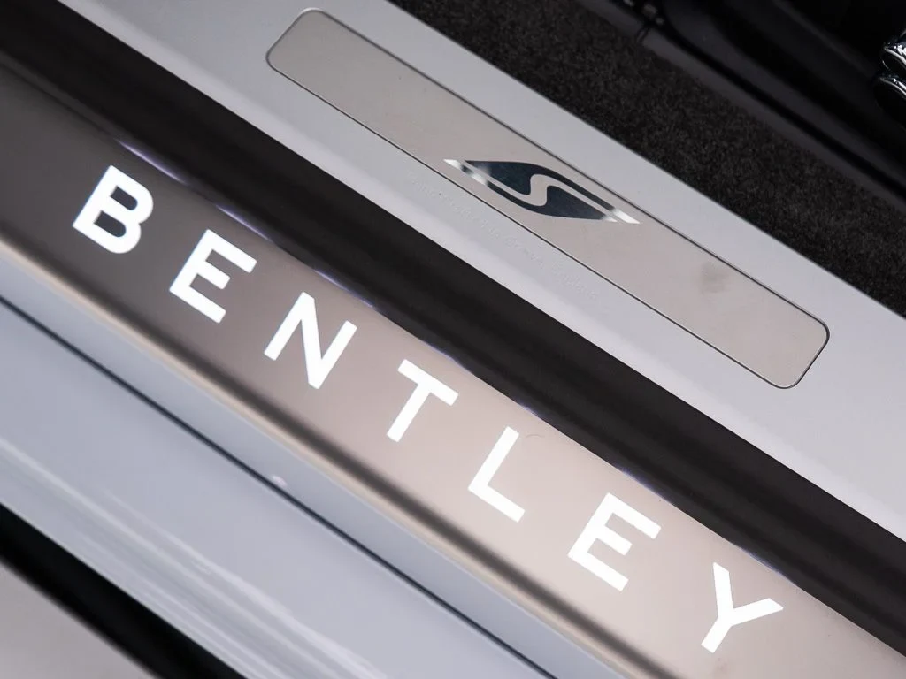 2026 Bentley Continental GTC S interior, door sill, Beluga / Mandarin - by Mulliner