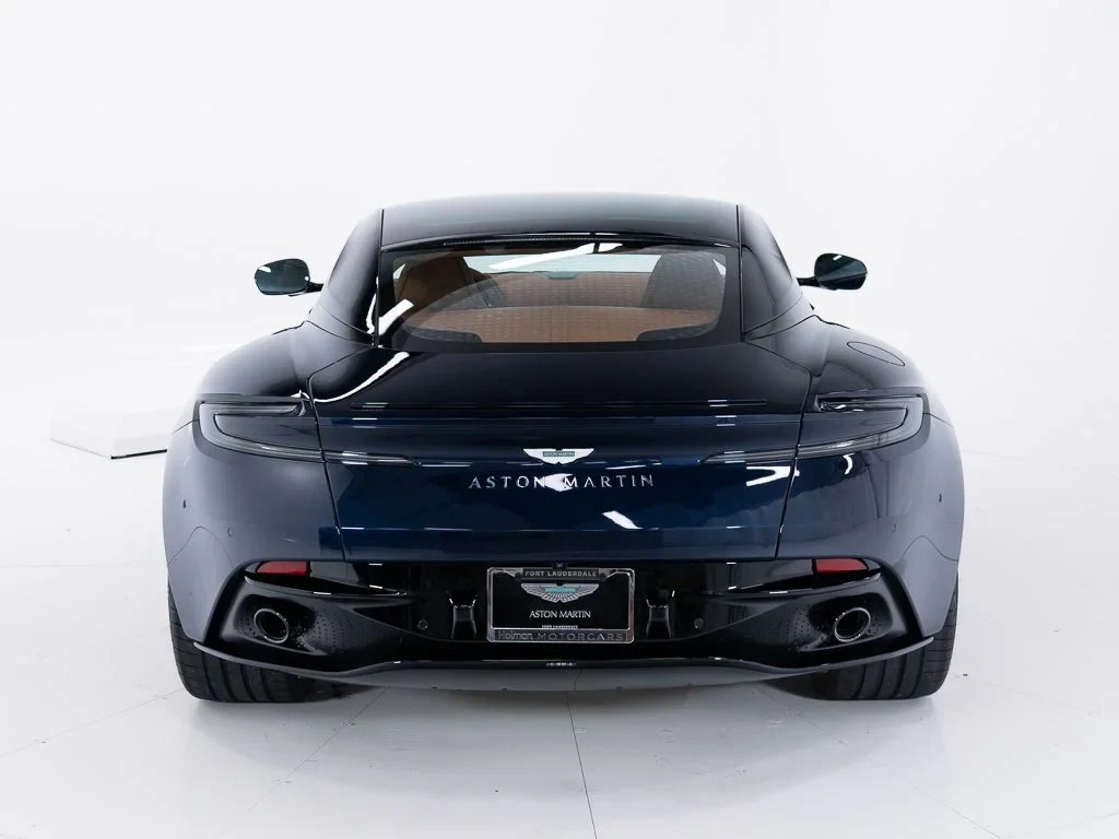 2026 Aston Martin DB12, rear three-quarter view, Midnight Blue