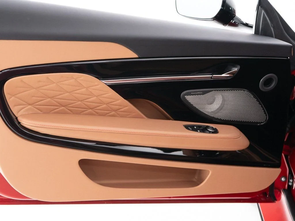 2026 Aston Martin DB12 Volante interior, door panel, Onyx Black / Copper Tan Metallic