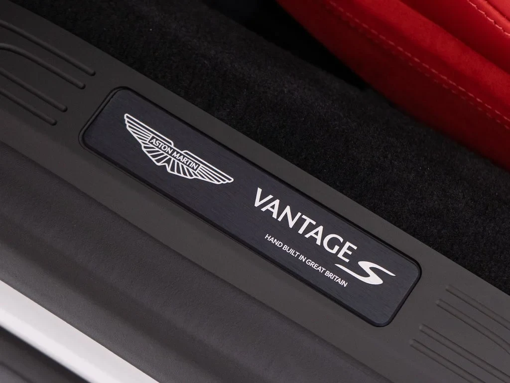 2026 Aston Martin Vantage S Roadster interior, door sill, Spicy Red w/Stitching in Obsidian Black