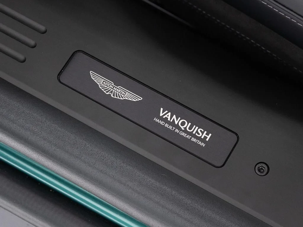2026 Aston Martin Vanquish interior, door sill, Onyx Black w/Accents in AMR Lime