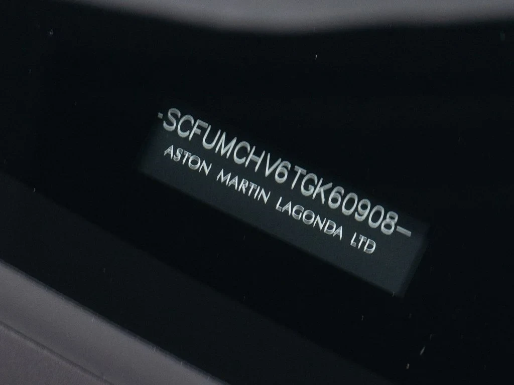 2026 Aston Martin Vanquish Volante interior, door sill, Dark Knight / Q Glacier White