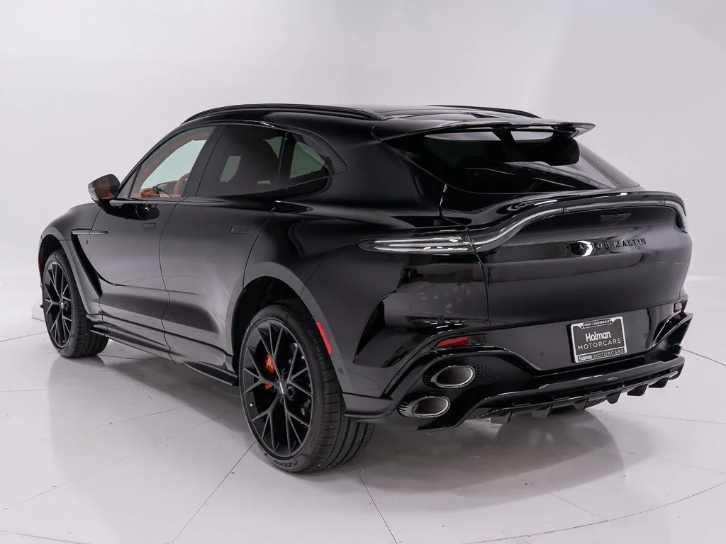 2026 Aston Martin DBX S, rear three-quarter view, Jet Black