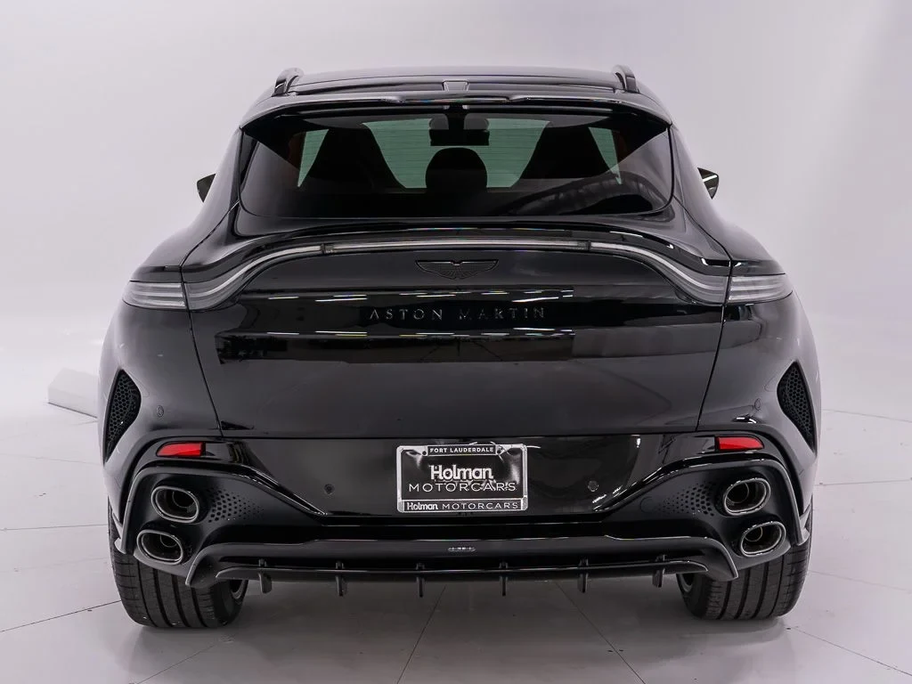 2026 Aston Martin DBX S, rear three-quarter view, Jet Black