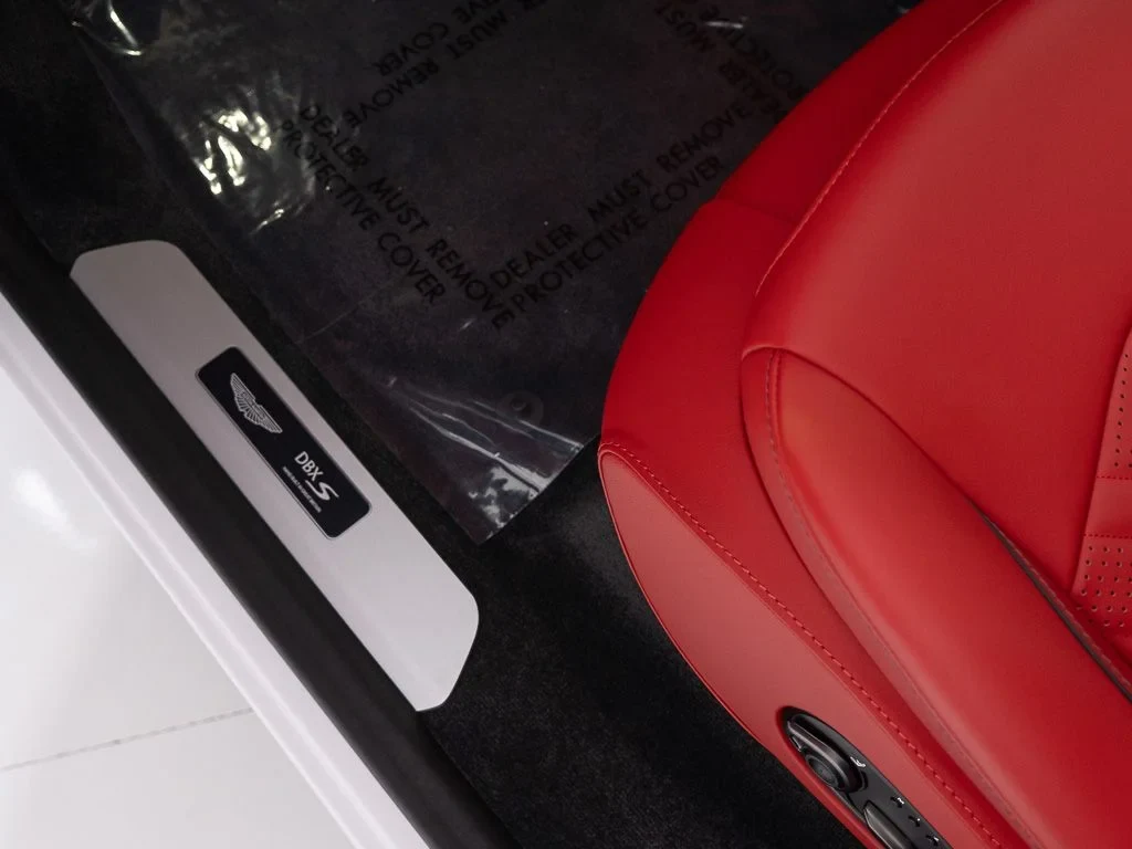 2026 Aston Martin DBX S interior, door panel, Spicy Red w/Stitching in Obsidian Black