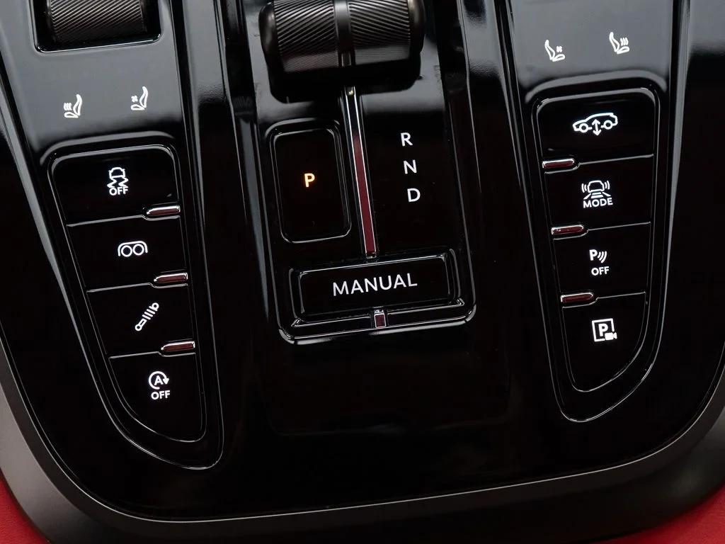 2026 Aston Martin DBX S interior, center console, Spicy Red w/Stitching in Obsidian Black