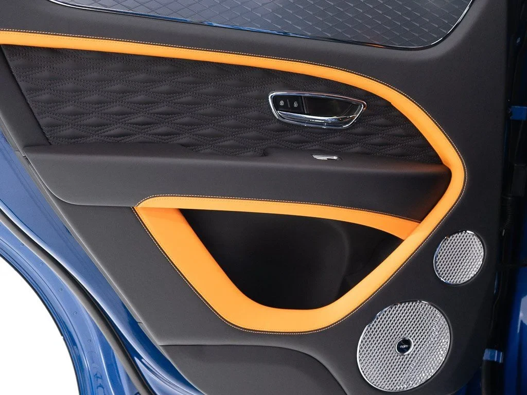 2026 Bentley Bentayga Speed interior, door panel, Beluga/Mandarin - by Mulliner