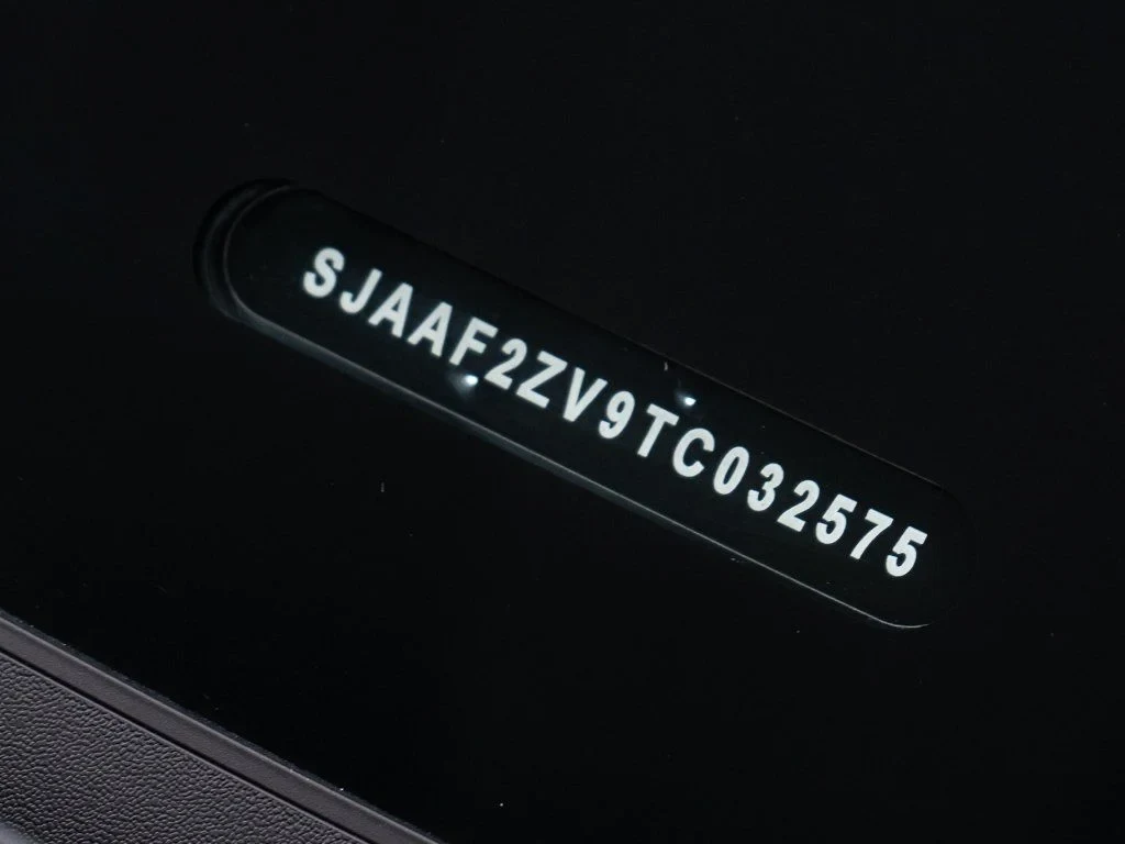 2026 Bentley Bentayga Speed interior, door sill, Beluga/Mandarin - by Mulliner