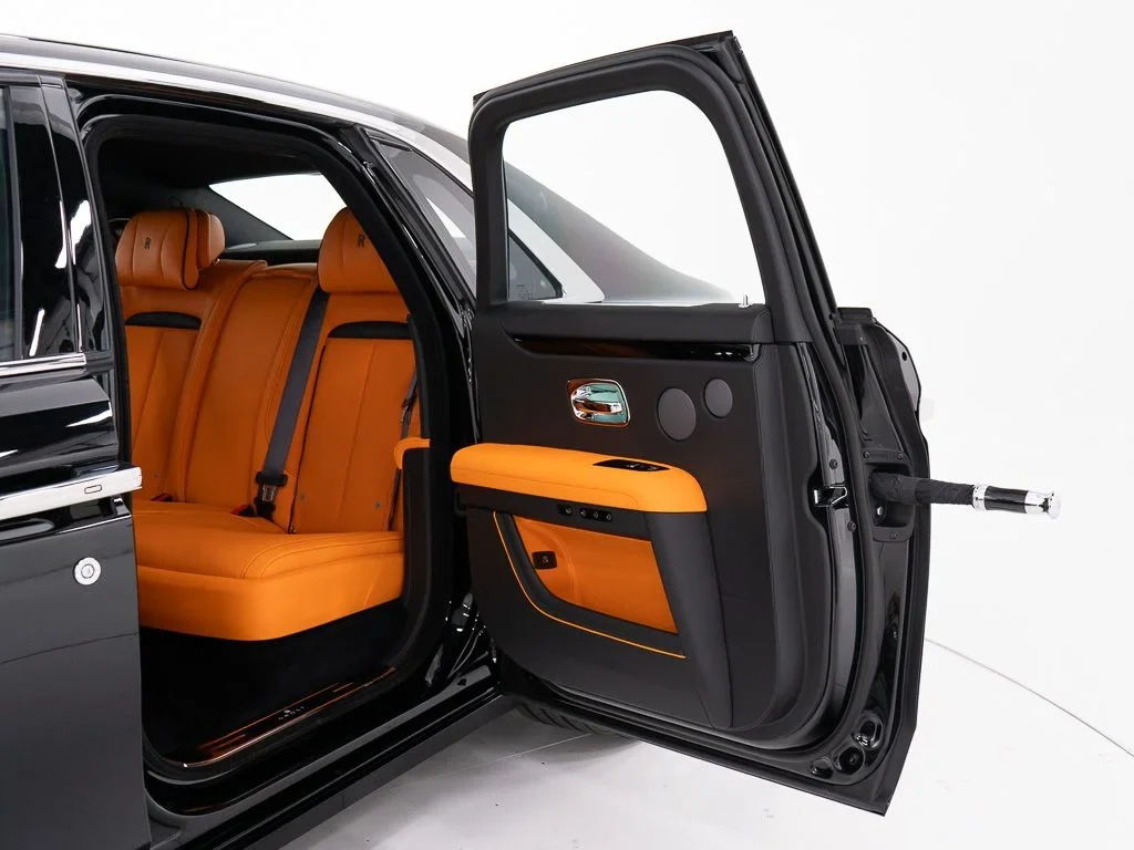 2027 Rolls-Royce Ghost interior, door panel, Mandarin / Black