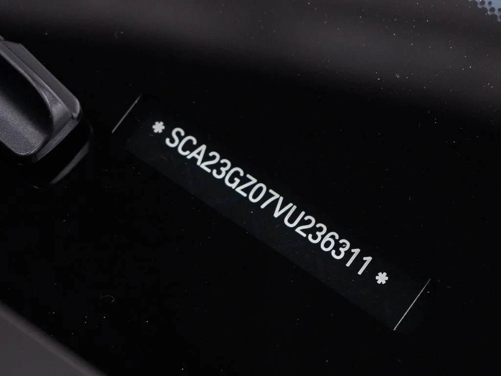 2027 Rolls-Royce Ghost interior, door sill, Mandarin / Black