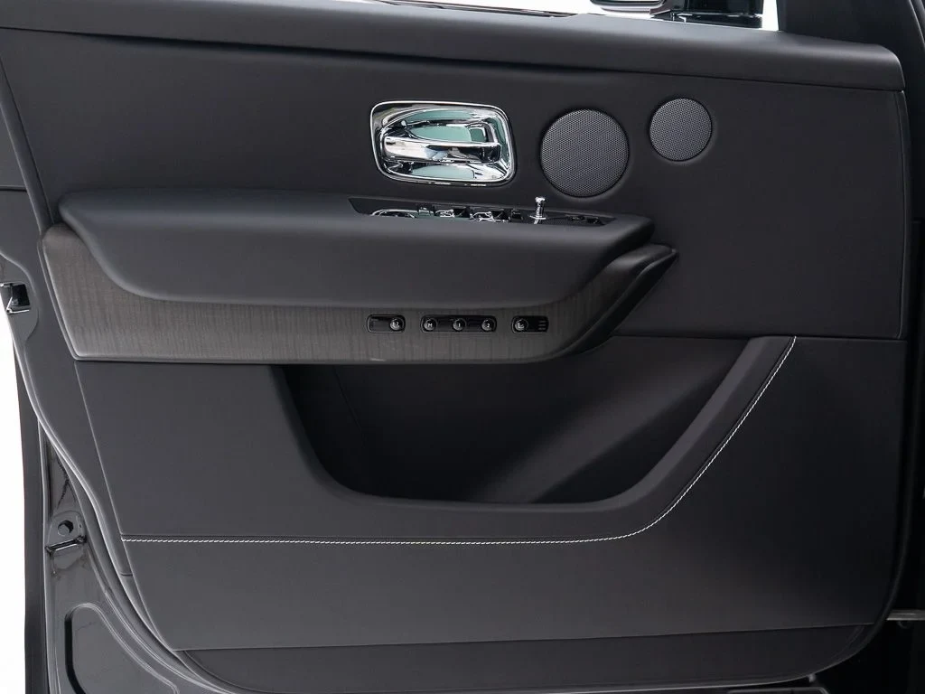2027 Rolls-Royce Cullinan interior, door panel, Black w/Stitching in Arctic White
