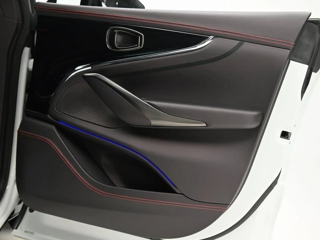2026 Aston Martin DBX 707 interior, door panel, Black Metallic with Spicy Red Stitching