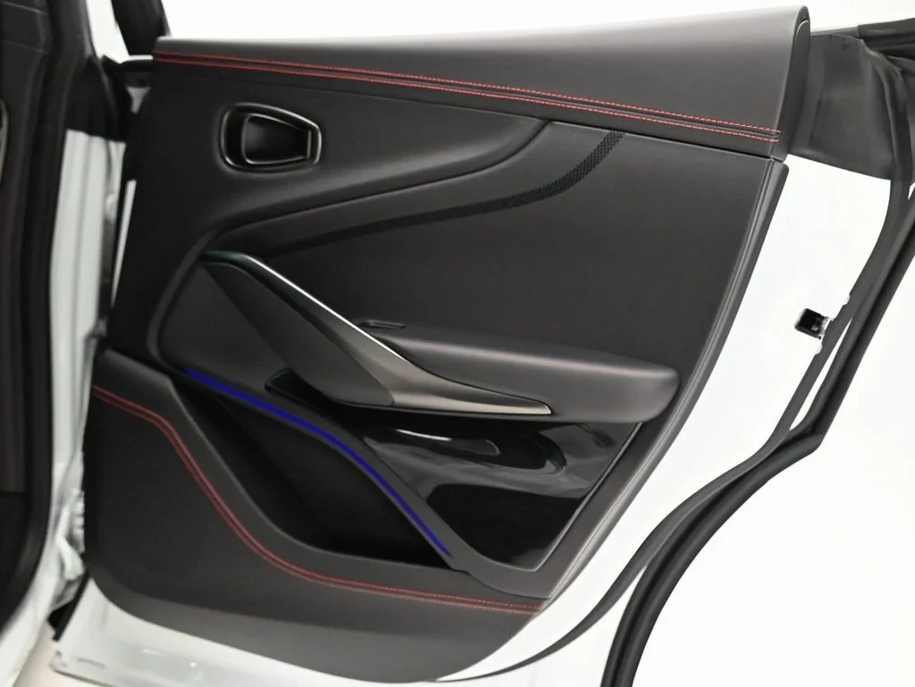 2026 Aston Martin DBX 707 interior, door panel, Black Metallic with Spicy Red Stitching