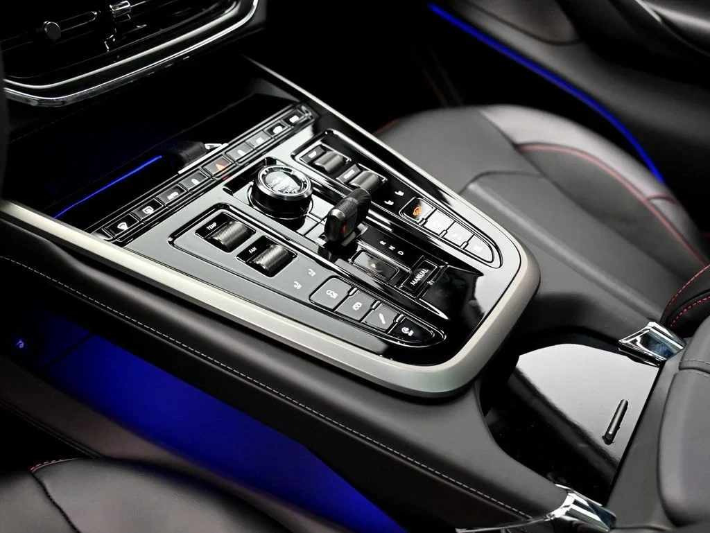 2026 Aston Martin DBX 707 interior, center console, Black Metallic with Spicy Red Stitching