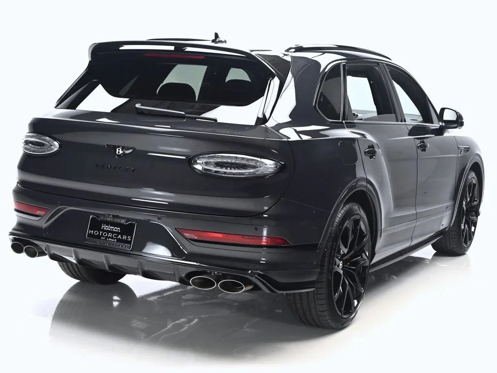 2026 Bentley Bentayga Speed, rear three-quarter view, Titan Grey