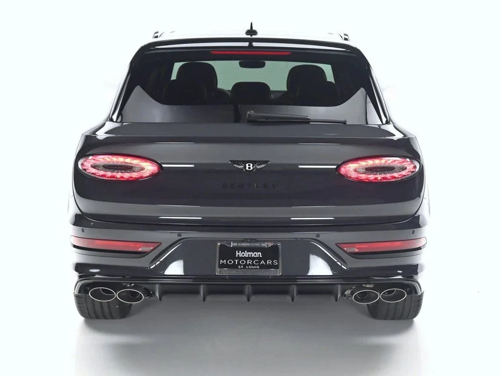 2026 Bentley Bentayga Speed, rear three-quarter view, Titan Grey