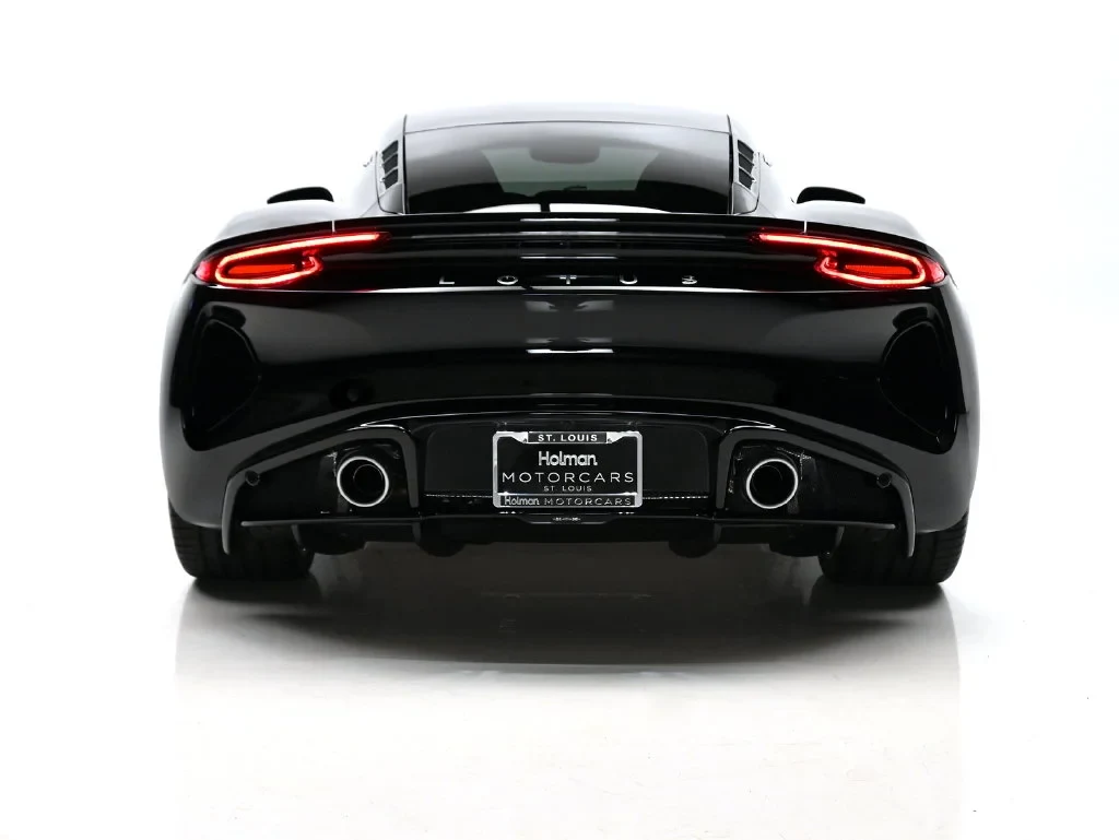 2027 Lotus Emira V6 SE, rear three-quarter view, Cosmos Black