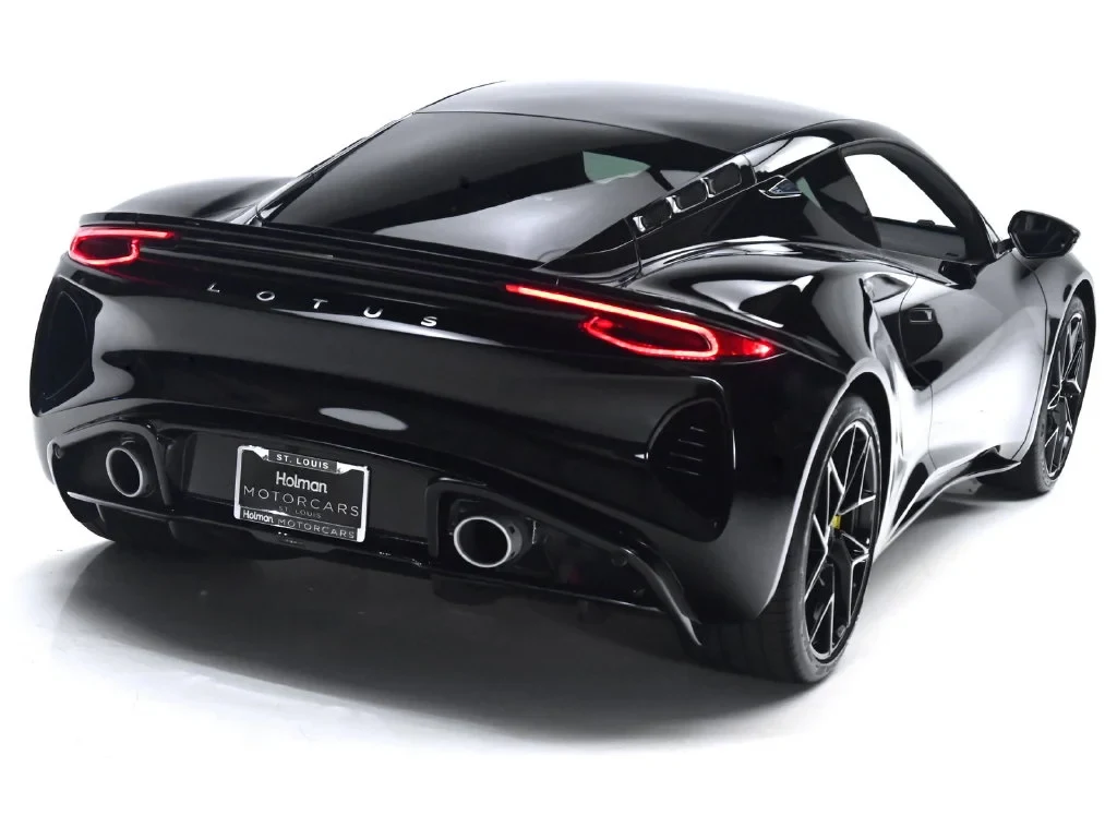 2027 Lotus Emira V6 SE, rear three-quarter view, Cosmos Black