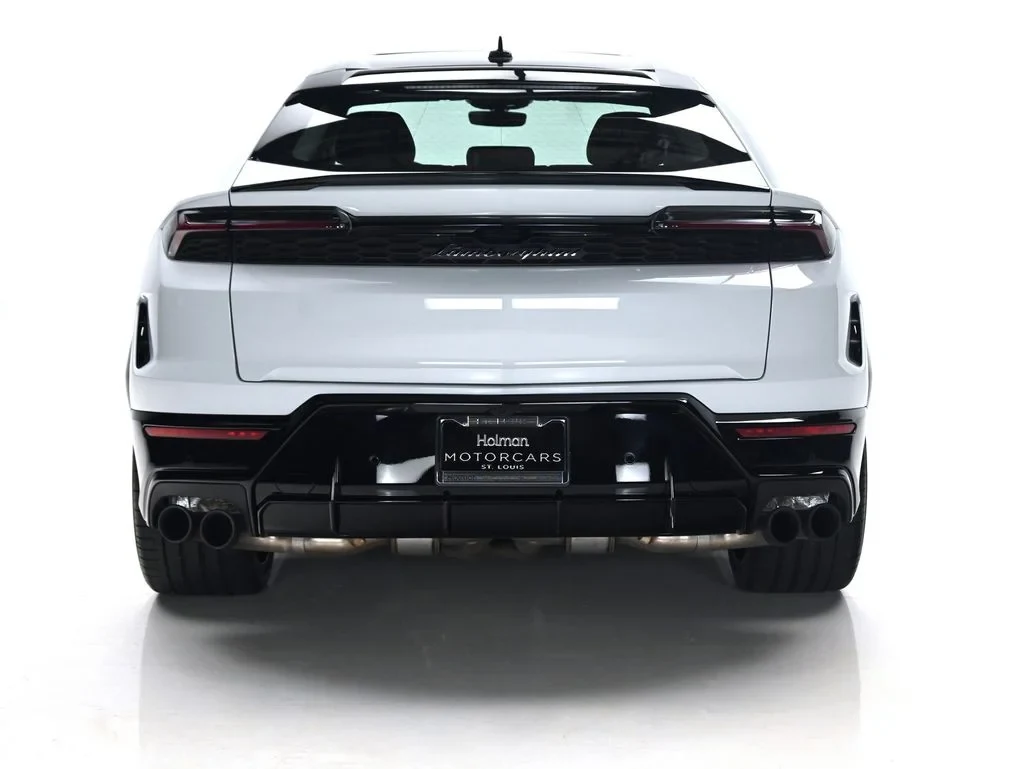 2026 Lamborghini Urus SE, rear three-quarter view, Bianco Icarus Metallic