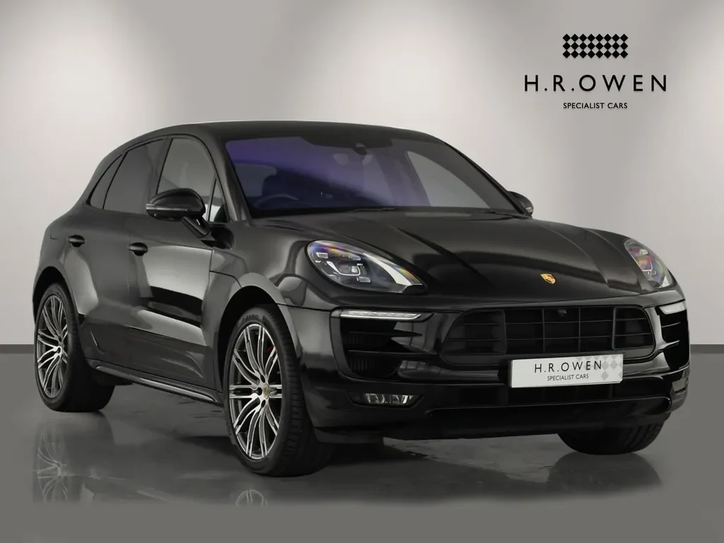 Porsche Macan, full-car front three-quarter view.