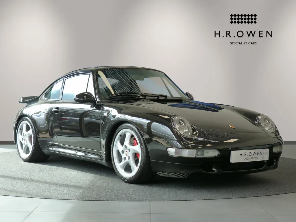 Porsche 911 Turbo, full-car front three-quarter view.